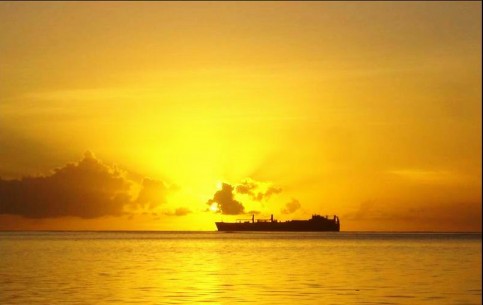 Saipan is a volcanic island in the Pacific Ocean with damp tropical climat; big lagoon, remains of tanks, airplanes and ships